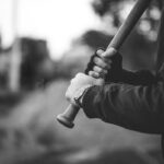 baseball-bat-hands-ready-to-attack-aggressive-hooligan-behind-80265336.jpg
